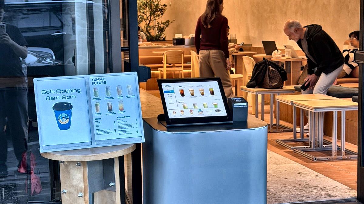 Customers at the ordering screens on the store's opening day